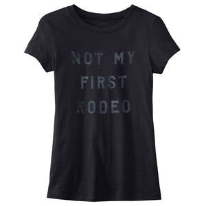 A Ladies cut sarcastic graphic t-shirt in Black, with custom vintage retro typography, reading “Not my first rodeo” — BY fashion brand YUF, from wolfsaint.net