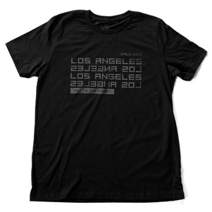 A stylish t-shirt in black, with modern/futuristic type graphic reading “LOS ANGELES” in forward and reverse, and the words “jet to the coast” below. From wolfsaint.net
