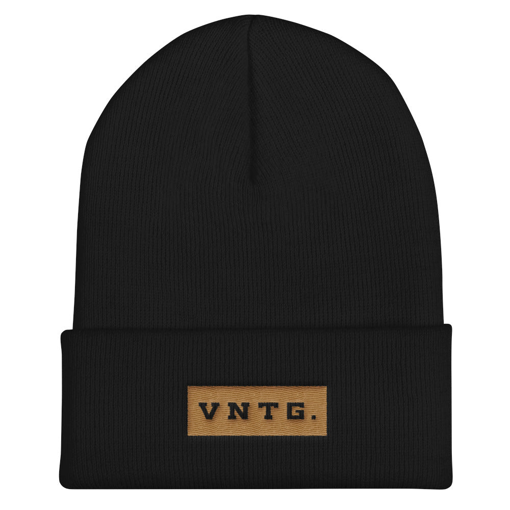 A stylish knit cap or beanie in classic Black, with the brand logo VNTG. embroidered in gold thread. From wolfsaint.net