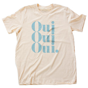 A stylish retro graphic t-shirt with a vintage typographic treatment repeating the French word “Oui” (Yes) three times. In robin’s egg blue on Soft Cream, by fashion brand YUF, from wolfsaint.net