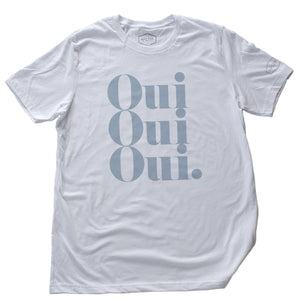 A stylish retro graphic t-shirt with a vintage typographic treatment repeating the French word “Oui” (Yes) three times. In antique blue on White, by fashion brand YUF, from wolfsaint.net