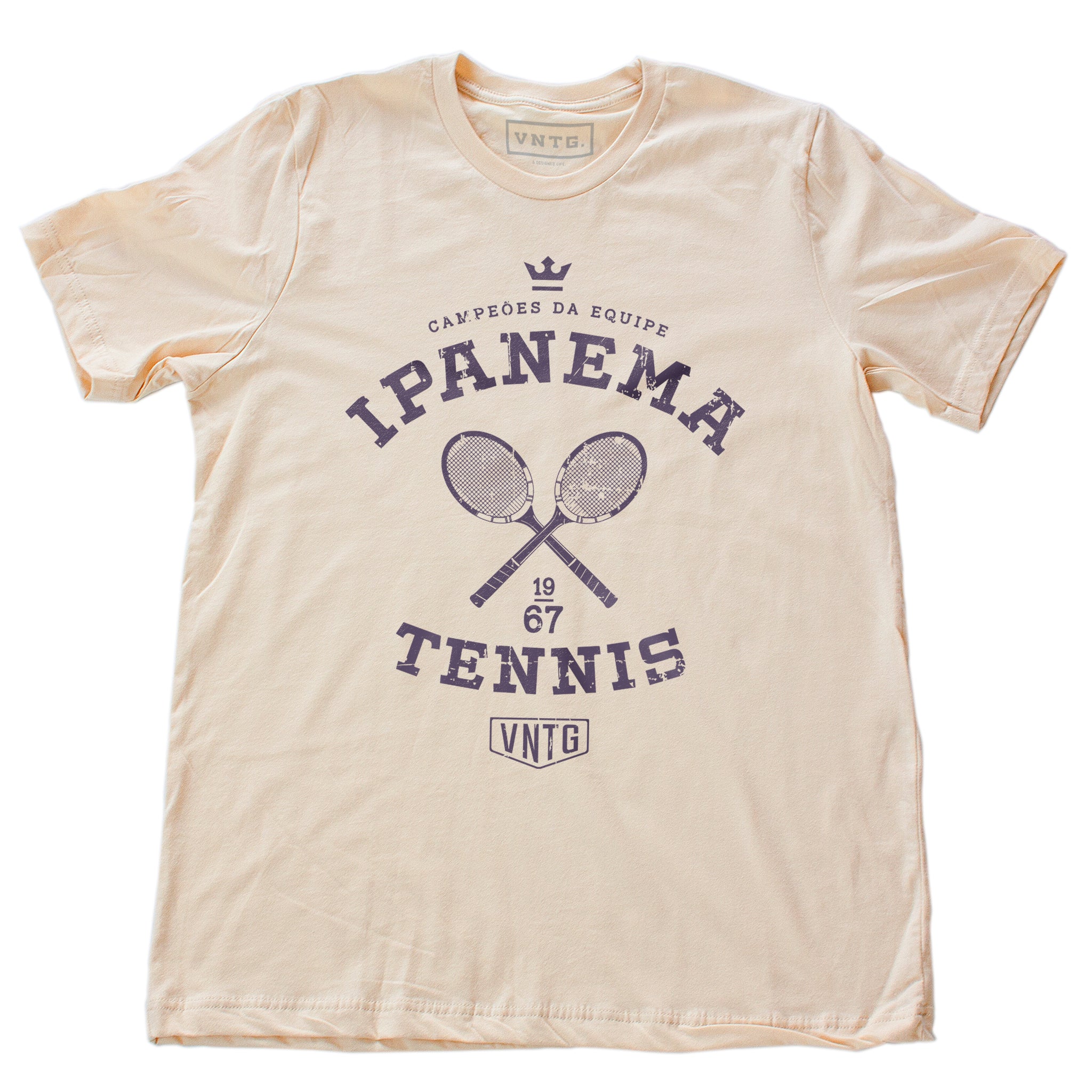 Vintage-inspired, retro graphic sports t-shirt in Soft Cream, as a ‘team’ shirt for a fictitious tennis team championship in Ipanema, Rio de Janeiro, Brazil. By fashion brand VNTG., from wolfsaint.net