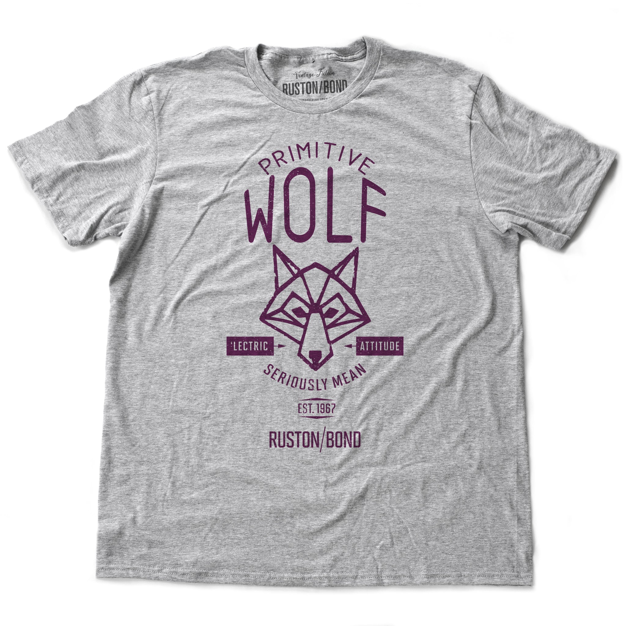 A fashionable, retro t-shirt in Classic Athletic Heather Gray, featuring a graphic of a “Primitive Wolf” and the text “Seriously mean” and “electric attitude.” By fashion brand Ruston/Bond, from wolfsaint.net