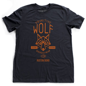A fashionable, retro t-shirt in Classic Navy Blue featuring a graphic of a “Primitive Wolf” and the text “Seriously mean” and “electric attitude.” By fashion brand Ruston/Bond, from wolfsaint.net