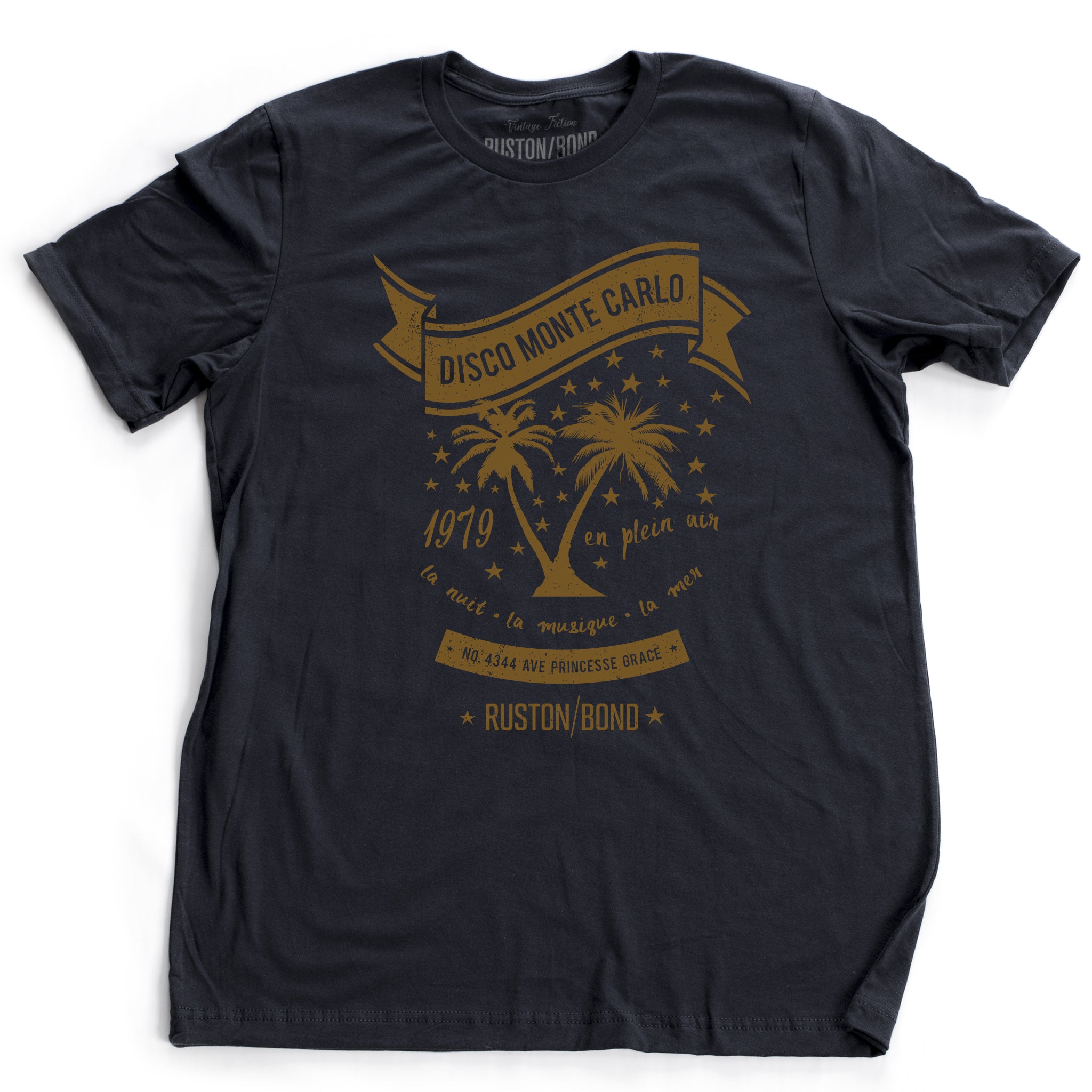 A retro, vintage-inspired t-shirt in navy blue, featuring palm trees against a starry sky, promoting a fictional Monte Carlo discotheque from the 1970s and 80s. By fashion brand Ruston/Bond, from wolfsaint.net