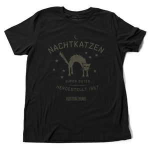 A vintage-inspired retro design graphic t-shirt in classic Black, featuring the image of an arched cat among stars, and the German text “NACHTKATZEN, Super Gutes” — translating to “Night Cats, super good” and the year 1967, with the Ruston/Bond logo beneath. From wolfsaint.net