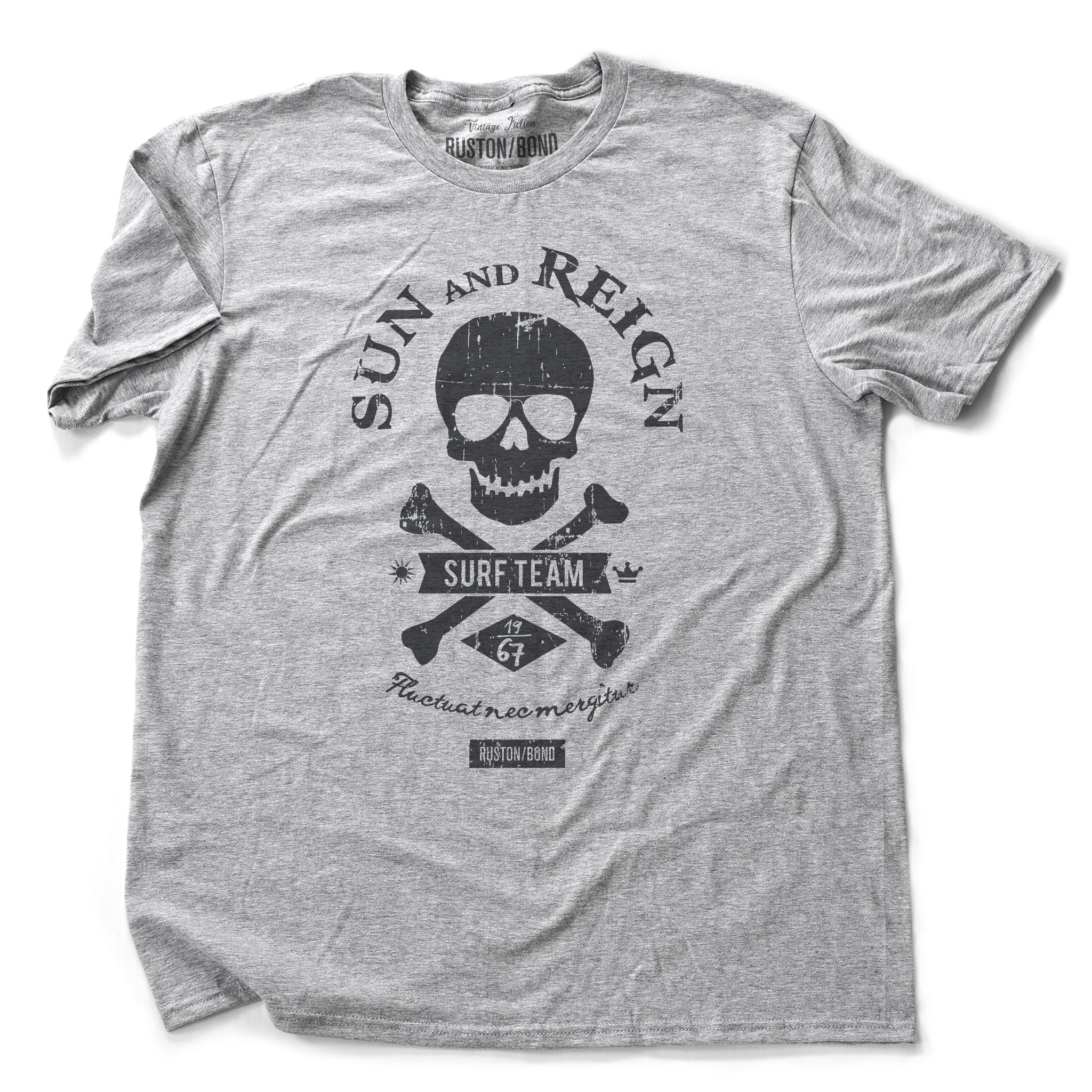 A fashionable, retro design t-shirt for a fictitious surf team. It features a skull and crossbones motif, surrounded by the typography SUN AND REIGN. By RUSTON/BOND, for wolfsaint.net