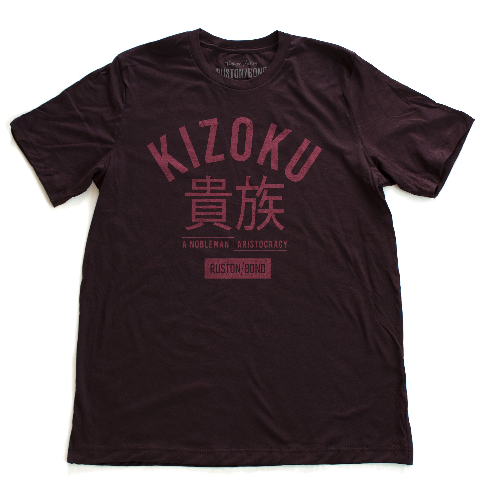 A retro fashion t-shirt in Oxblood with the bold typographic of the Japanese word “KIZOKU” and “a nobleman / aristocracy” below the Japanese characters. By the fashion brand Ruston/Bond, from wolfsaint.net. 
