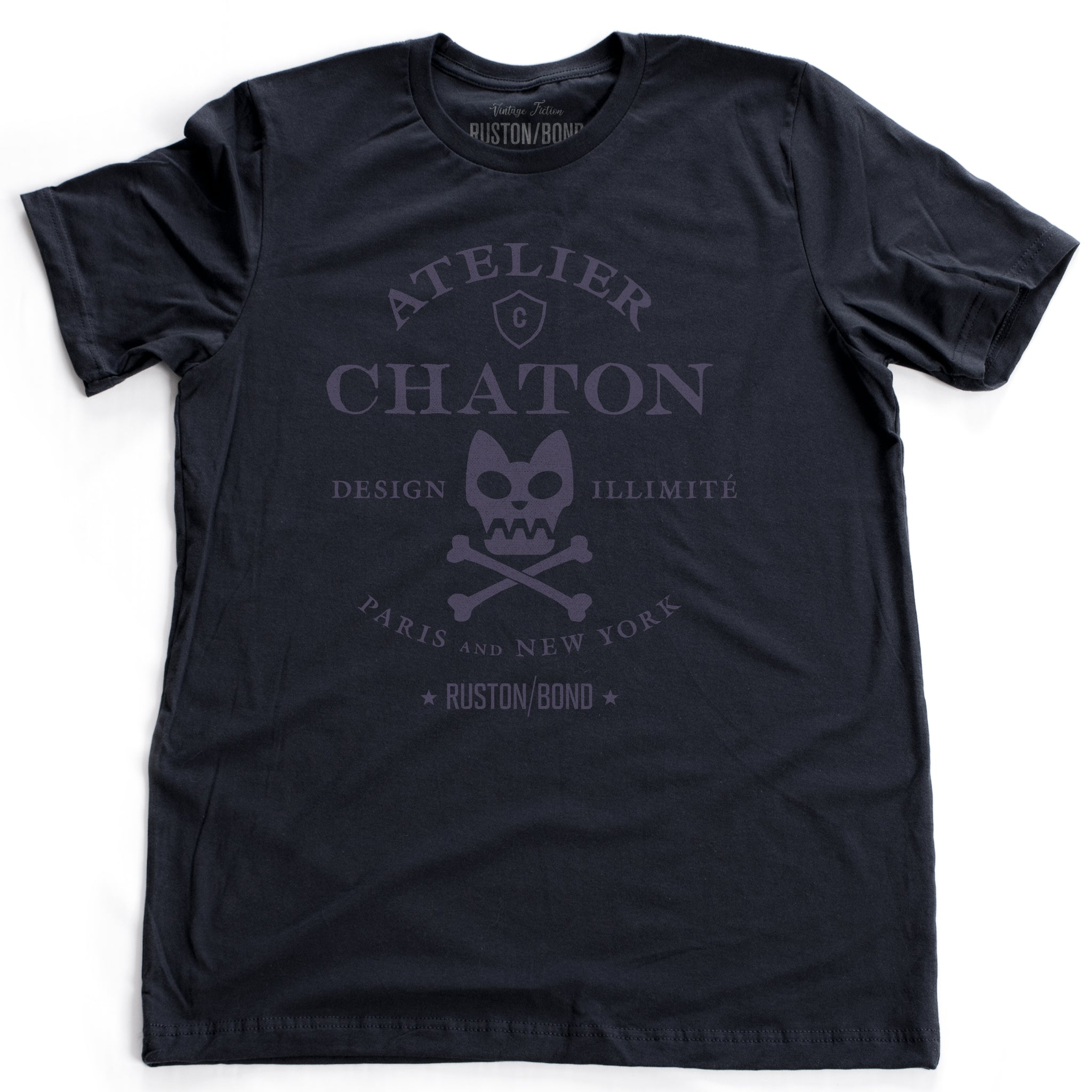 Navy Blue retro, vintage-inspired fashion t-shirt for a fictional graphic design studio in Paris and New York, featuring a graphic of a cat skull and cross bones, from brand Ruston/Bond. From wolfsaint.net