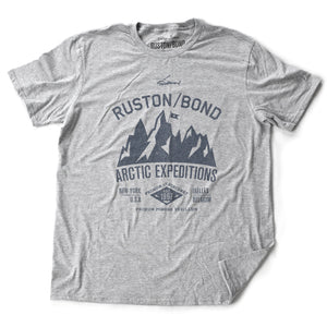 Athletic Gray / Grey  classic, fashion, retro inspired t-shirt, with a fictional advertisement for an adventure company called Ruston/Bond Arctic Expeditions. It shows a mountain range and a helicopter, and lists the company locations in New York City and Ixelles, Belgium, and a Latin quote.  Inspired by the films of Wes Anderson. From wolfsaint.net