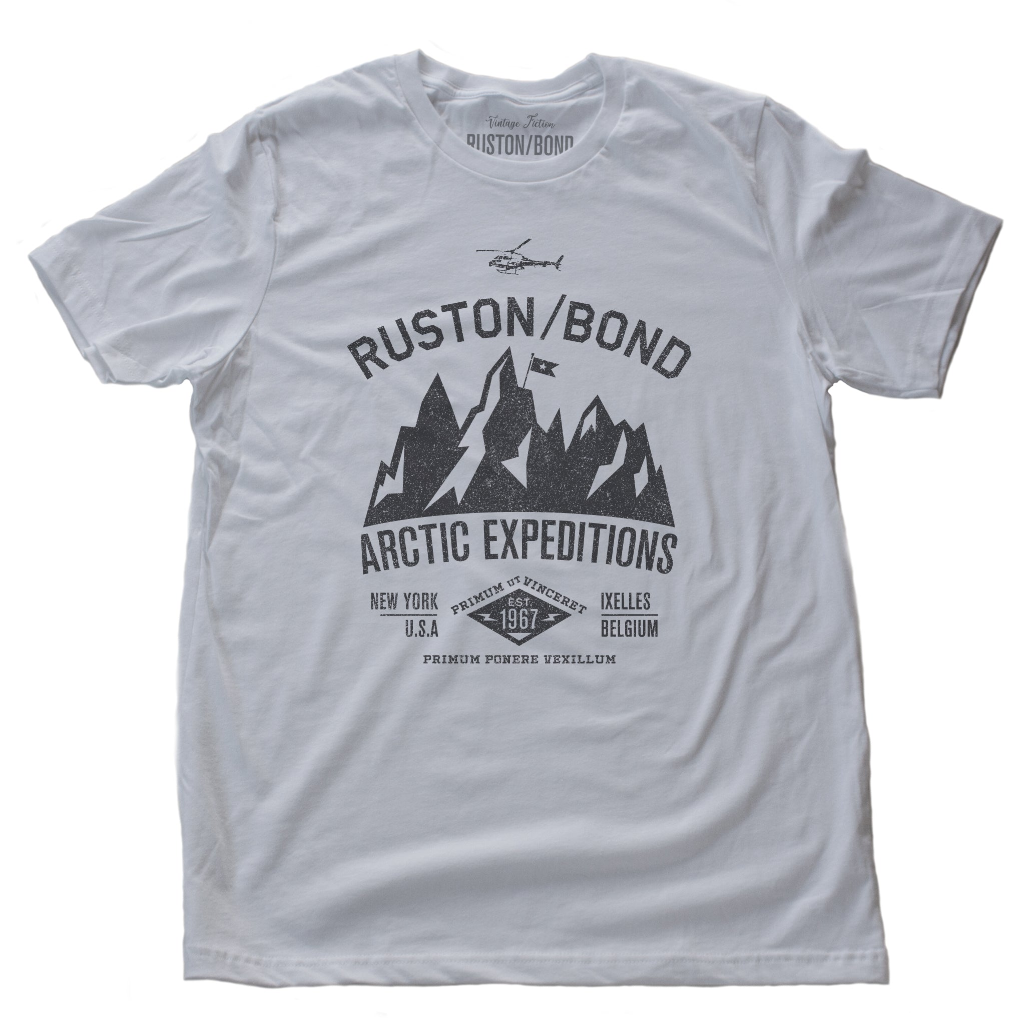 White  classic, fashion, retro inspired t-shirt, with a fictional advertisement for an adventure company called Ruston/Bond Arctic Expeditions. It shows a mountain range and a helicopter, and lists the company locations in New York City and Ixelles, Belgium, and a Latin quote.