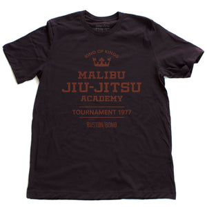 A fashionable, vintage-inspired retro t-shirt in Oxblood, featuring a graphic commemorating a sarcastic and fictitious Malibu (California) Jiu Jitsu academy and a 1977 tournament. By fashion brand Ruston/Bond, from wolfsaint.net