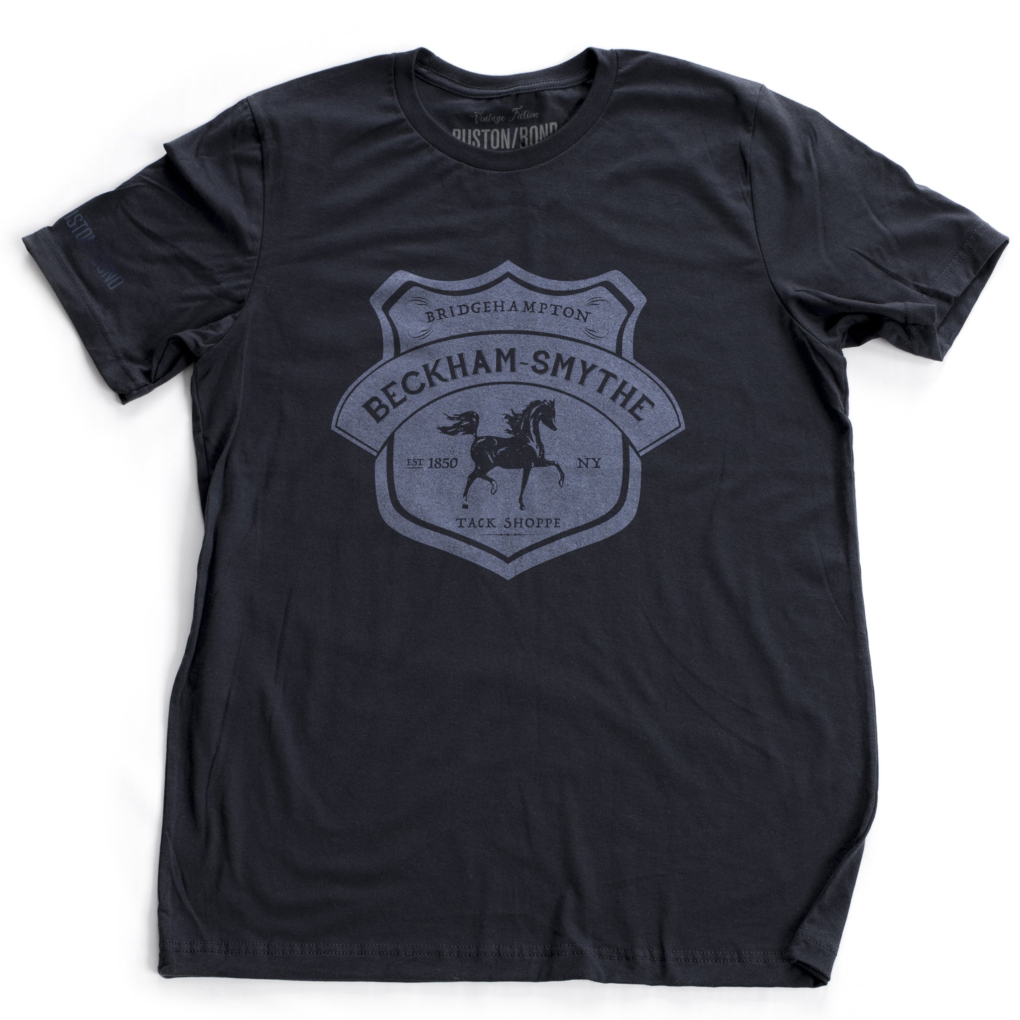 Navy Blue fashion style, retro, vintage-inspired t-shirt with a classic graphic of a fictional Tack shop in the Hamptons, New York (Bridgehampton). From the stylish brand Ruston/Bond, with a parody of Hermes style.