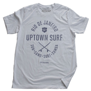 A retro design graphic t-shirt in white, featuring twin surf boards and the text RIO DE JANEIRO for the store "Uptown Surf" and its motto below, "Sun, Sand, Surf, Samba," by fashion brand Ruston/Bond, for wolfsaint.net