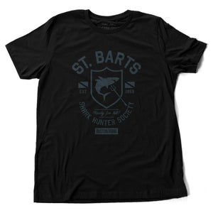 A vintage-inspired, retro design graphic t-shirt with sarcastic fictitious art, featuring a shark within a shield, for the imaginary St Bart’s Shark Hunter Society. By fashion brand Ruston/Bond, for wolfsaint.net