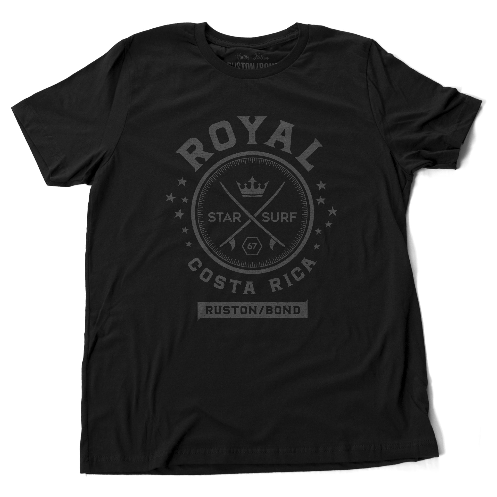 A vintage-inspired Classic Black t-shirt with a retro graphic of crossed surfboards and a crown, surrounded by the words ROYAL / STAR SURF / COSTA RICA. By the fashion brand Ruston/Bond, for Wolfsaint.net