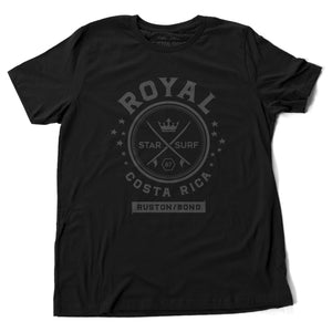 A vintage-inspired Classic Black t-shirt with a retro graphic of crossed surfboards and a crown, surrounded by the words ROYAL / STAR SURF / COSTA RICA. By the fashion brand Ruston/Bond, for Wolfsaint.net