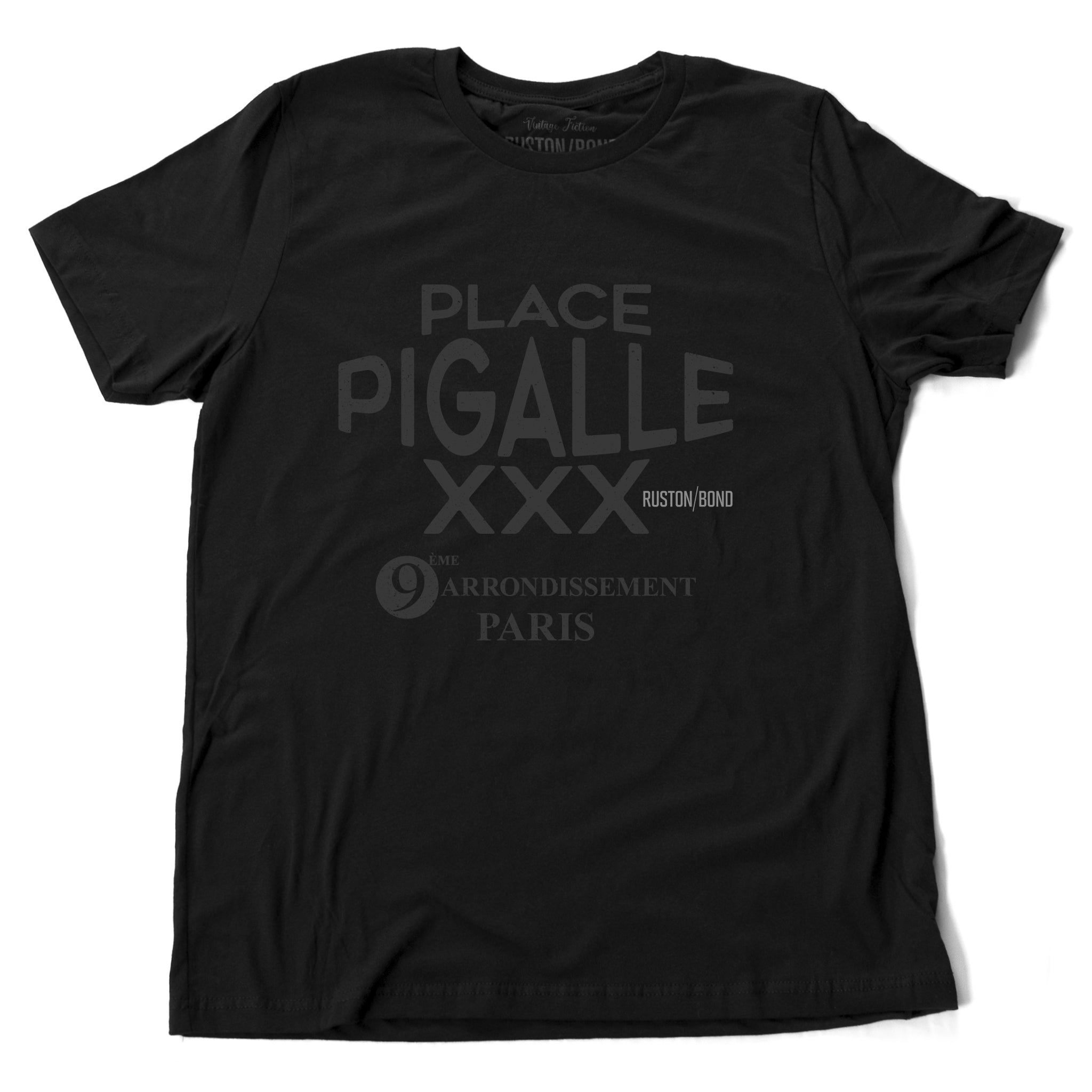 A fashionable graphic t-shirt in Classic Black, promoting a fictional adult entertainment establishment in Paris: “Place Pigalle XXX, 9th Arrondisement” By Ruston/Bond, from Wolfsaint.net