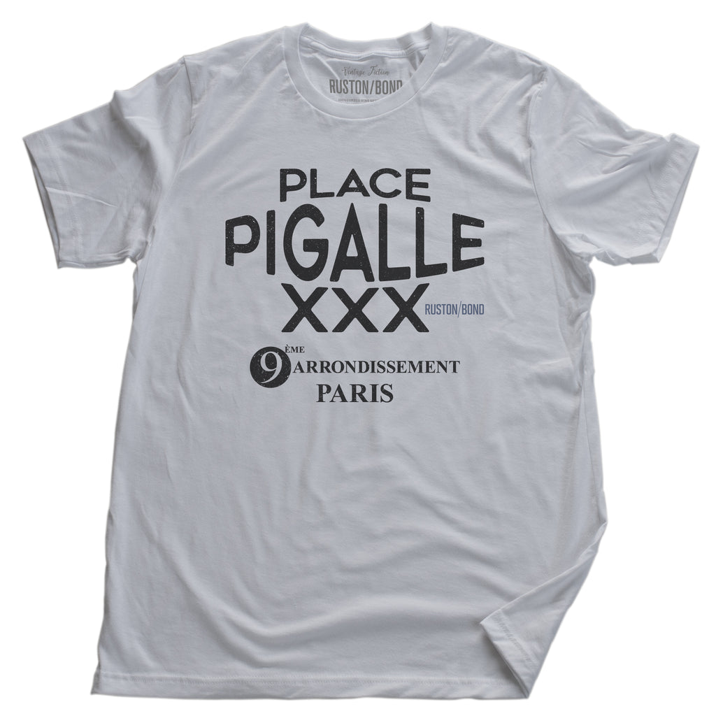 A fashionable graphic t-shirt in White, promoting a fictional adult entertainment establishment in Paris: “Place Pigalle XXX, 9th Arrondisement” By Ruston/Bond, from Wolfsaint.net
