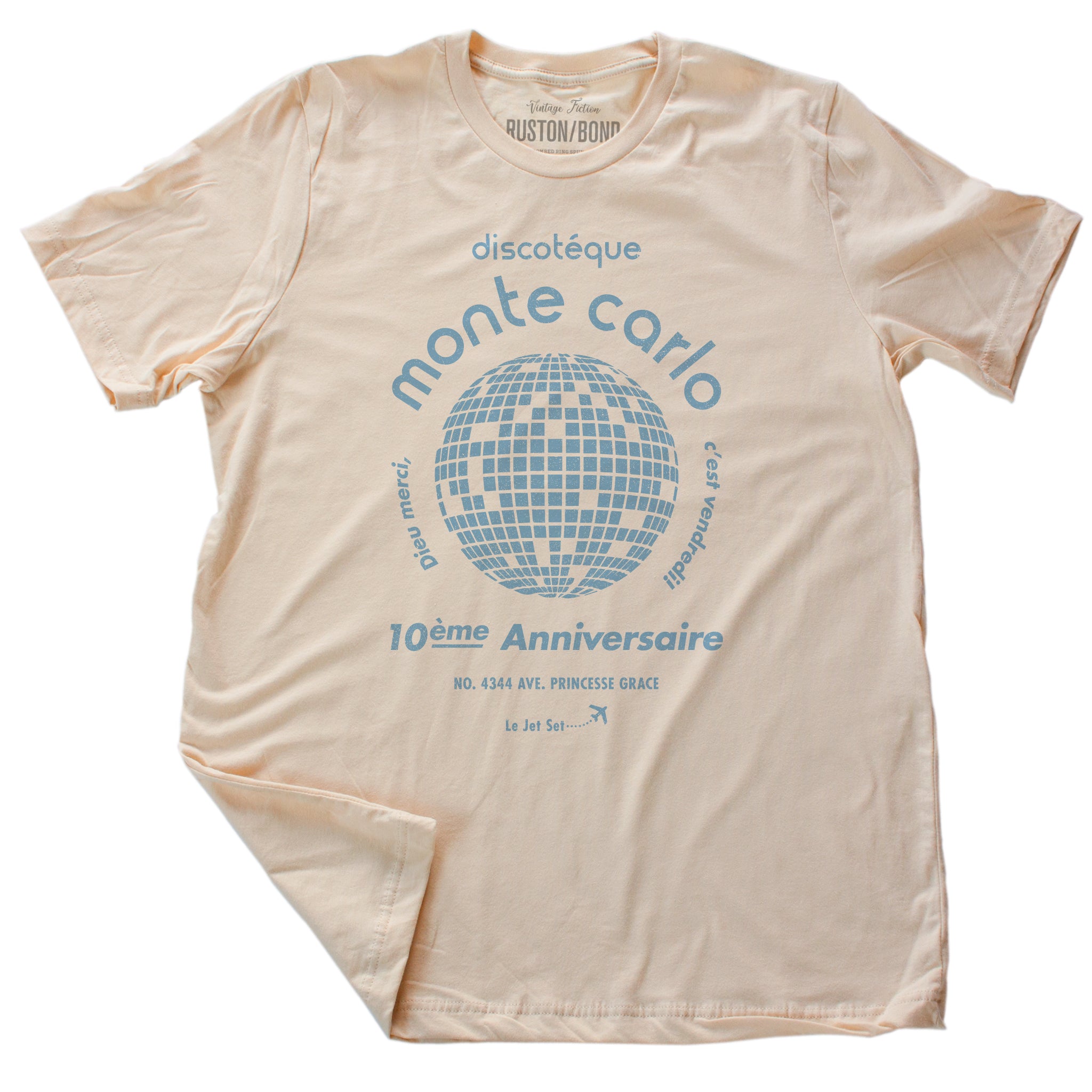 A retro, vintage-inspired t-shirt in Soft Cream, with a disco ball graphic, promoting a fictional Monte Carlo discotheque from the 1970s and 80s. By fashion brand Ruston/Bond, from wolfsaint.net
