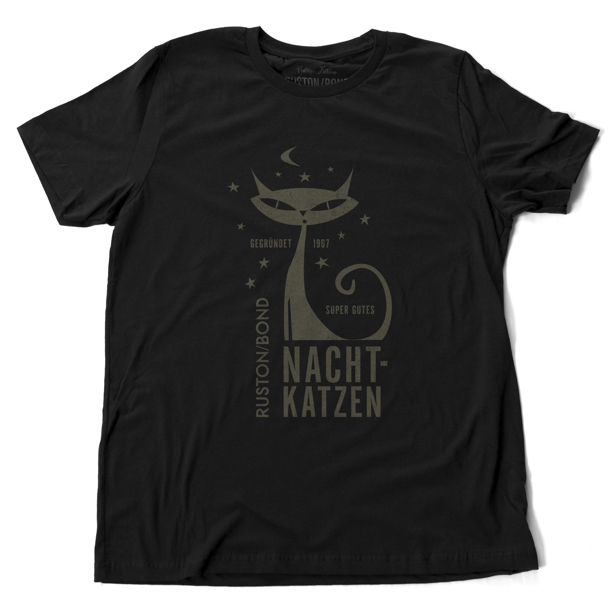 A vintage-inspired retro design t-shirt in classic Black, featuring the image of a stylized cat graphic among stars, and the German text “NACHTKATZEN, Super Gutes” — translating to “Night Cats, super good” and the year 1967, with the Ruston/Bond logo beneath. From wolfsaint.net