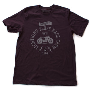 A vintage-inspired retro t-shirt for a fictitious motorcycle race crew. For the café racer genre of vintage motorcycles, this shirt reads “Lightning Bluff Race Crew, established 1967” in Oxblood/burgundy, by fashion brand VNTG., for wolfsaint.net 