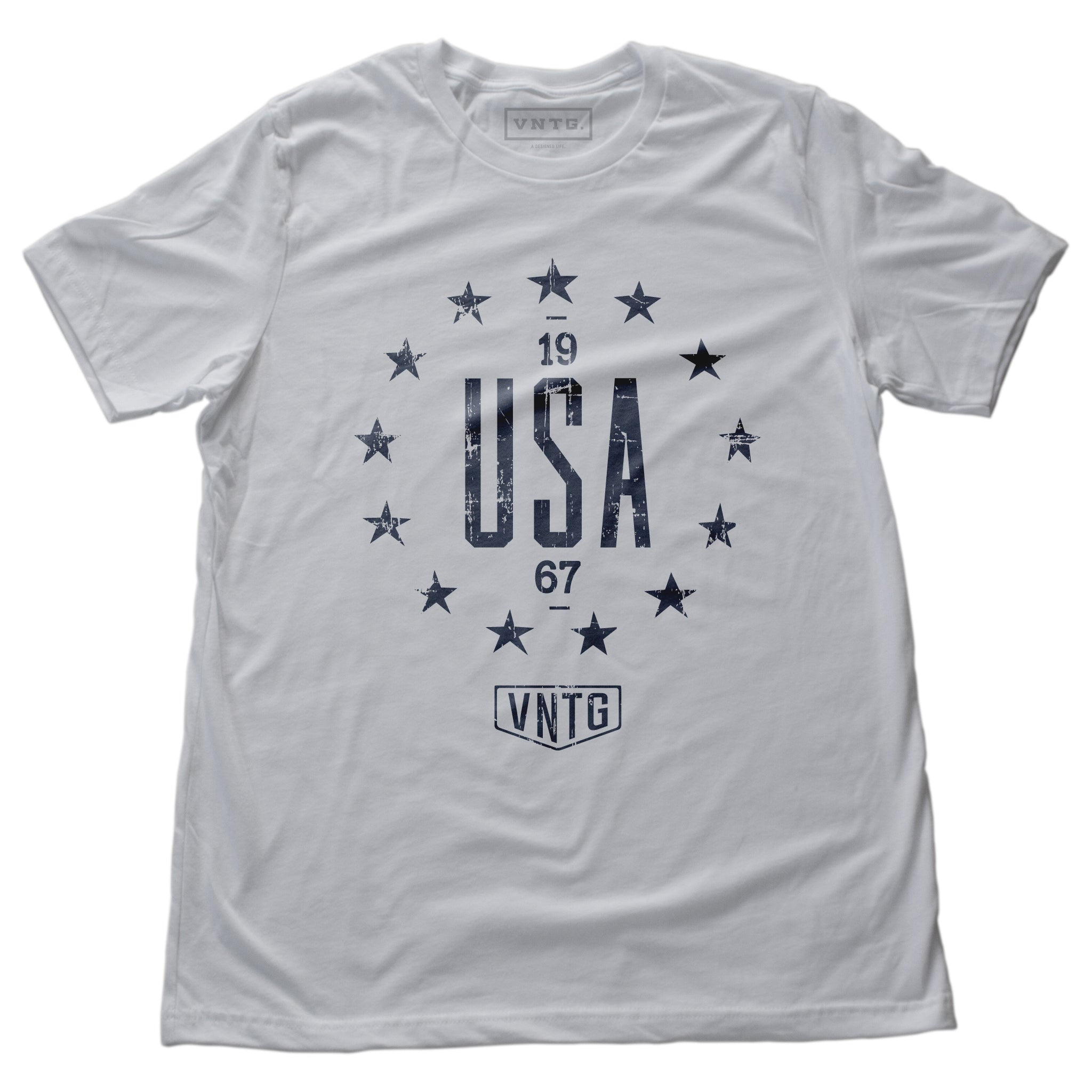 A vintage inspired, classic, retro design, graphic t-shirt with “USA” in large letters, surrounded by 13 stars of the original American colonies, and the VNTG. logo beneath. From wolfsaint.net