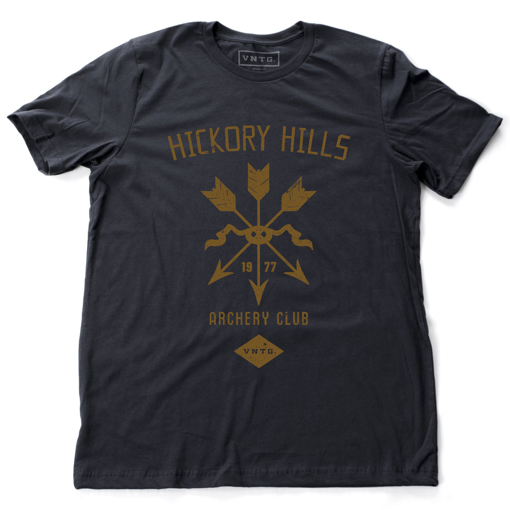 A vintage-inspired retro t-shirt in Navy Blue, featuring a graphic of a quiver of arrows, representing a small town amateur archery club from 1977.  By fashion brand VNTG, from wolfsaint.net