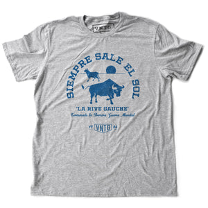 A Classic fashion t-shirt celebrating Ernest Hemingway’s novel “THE SUN ALSO RISES,” in its Spanish language translation. It reads “SIEMORE SALE EL SOL” around the image of two bulls, and “la rice gauche.” By fashion brand VNTG., from wolfsaint.net