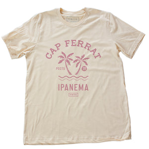 Soft cream fashion t-shirt featuring a stylish retro, vintage-inspired graphic of two palm trees against the waves, and the words Cap Ferrat, Ipanema, a popular beach spot in Rio de Janeiro, Brazil. From wolfsaint.net
