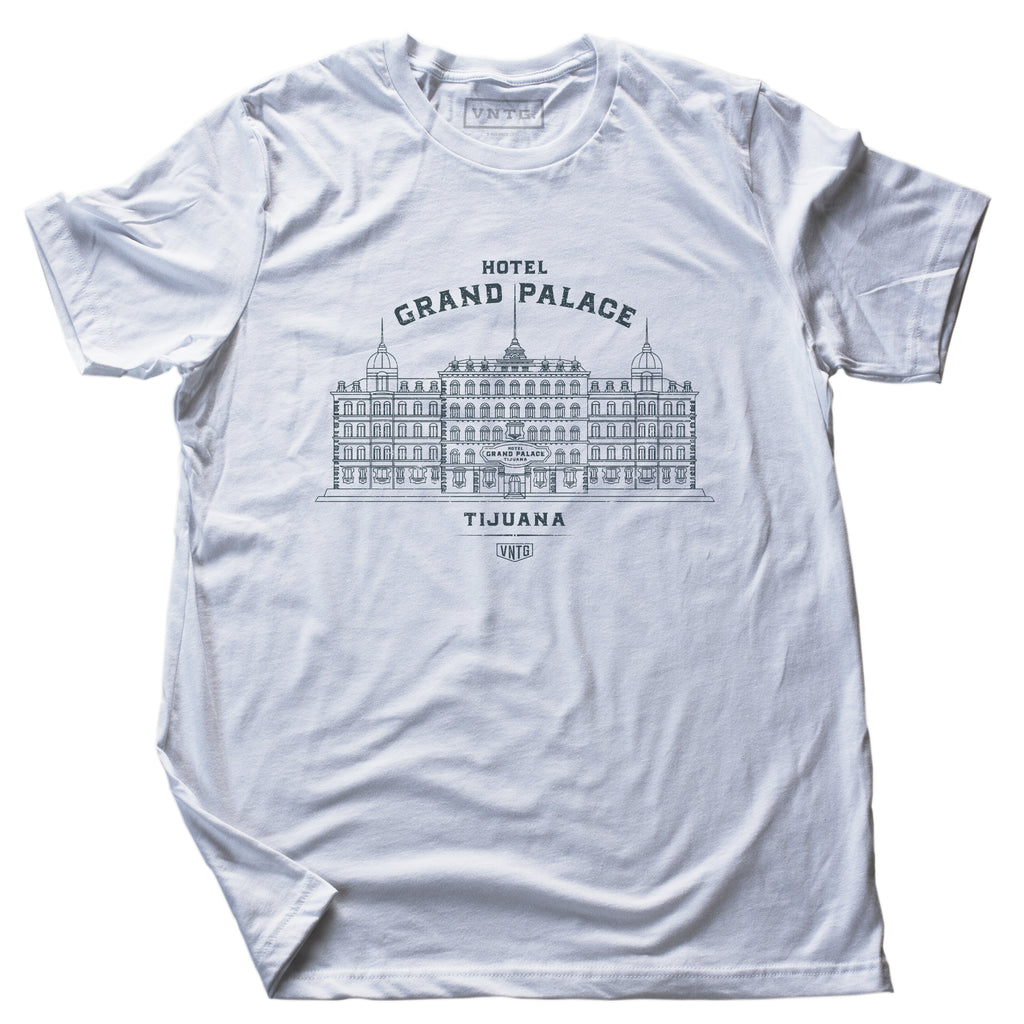 A vintage-inspired retro t-shirt in white, promoting a fictional, sarcastic grand hotel in Tijuana, Mexico. From fashion brand VNTG, from wolfsaint.net The shirt depicts an elegant old hotel in an intricate line drawing. Inspired by the films of Wes Anderson, including The Grand Budapest Hotel. 