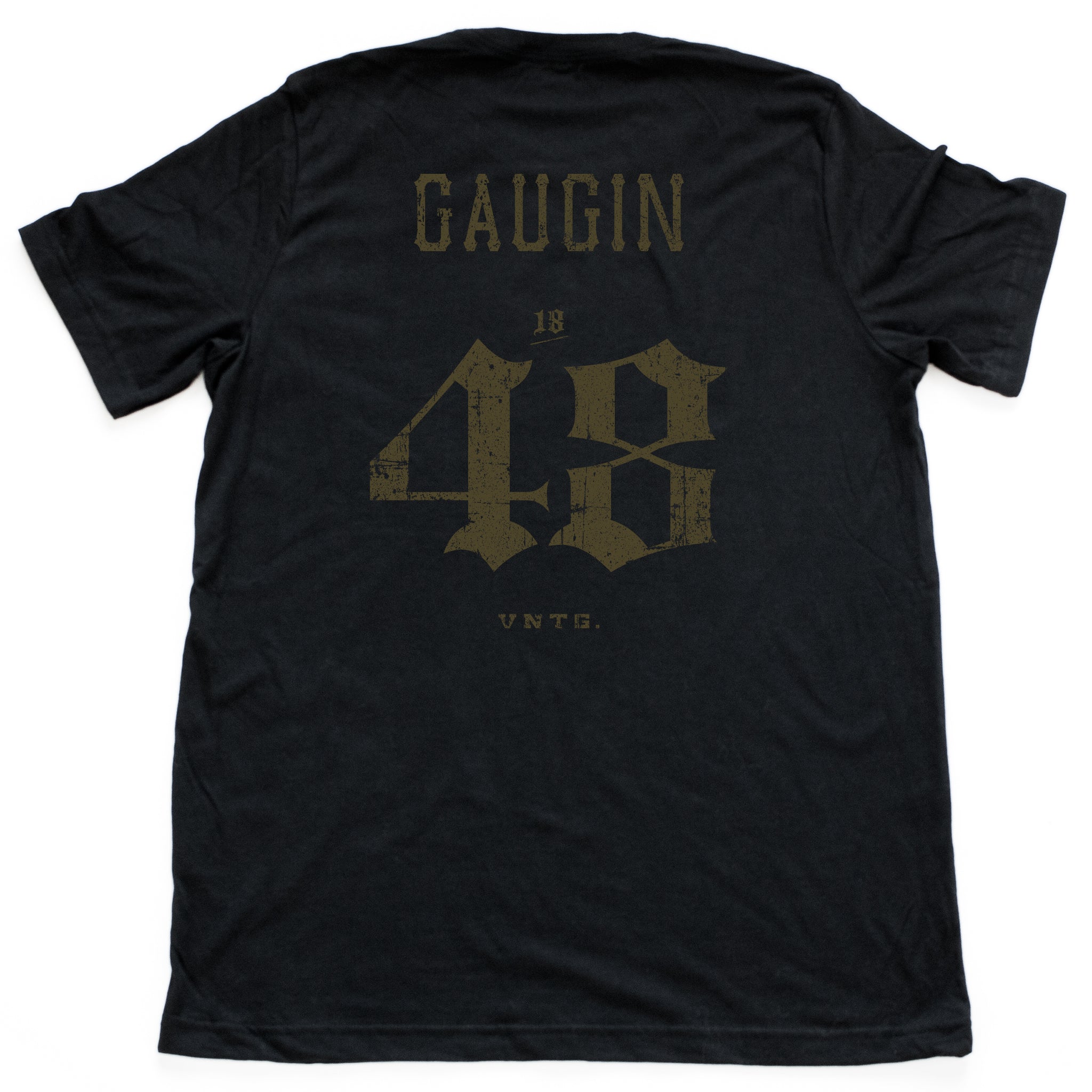 A vintage-inspired retro t-shirt in a mock athletic style, with a sarcastic nod to liberal arts college. This shirt, in Classic black, features the name of the fauve impressionist painter GAUGUIN and his birth year ‘48 on the back. By fashion brand VNTG., from wolfsaint.net