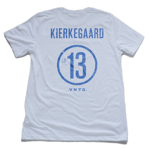A vintage-inspired retro t-shirt in a mock athletic style, with a sarcastic nod to liberal arts college. This shirt, in Classic White, features the name of philosopher KIERKEGAARD and his birth year 1813 on the back. By fashion brand VNTG., from wolfsaint.net