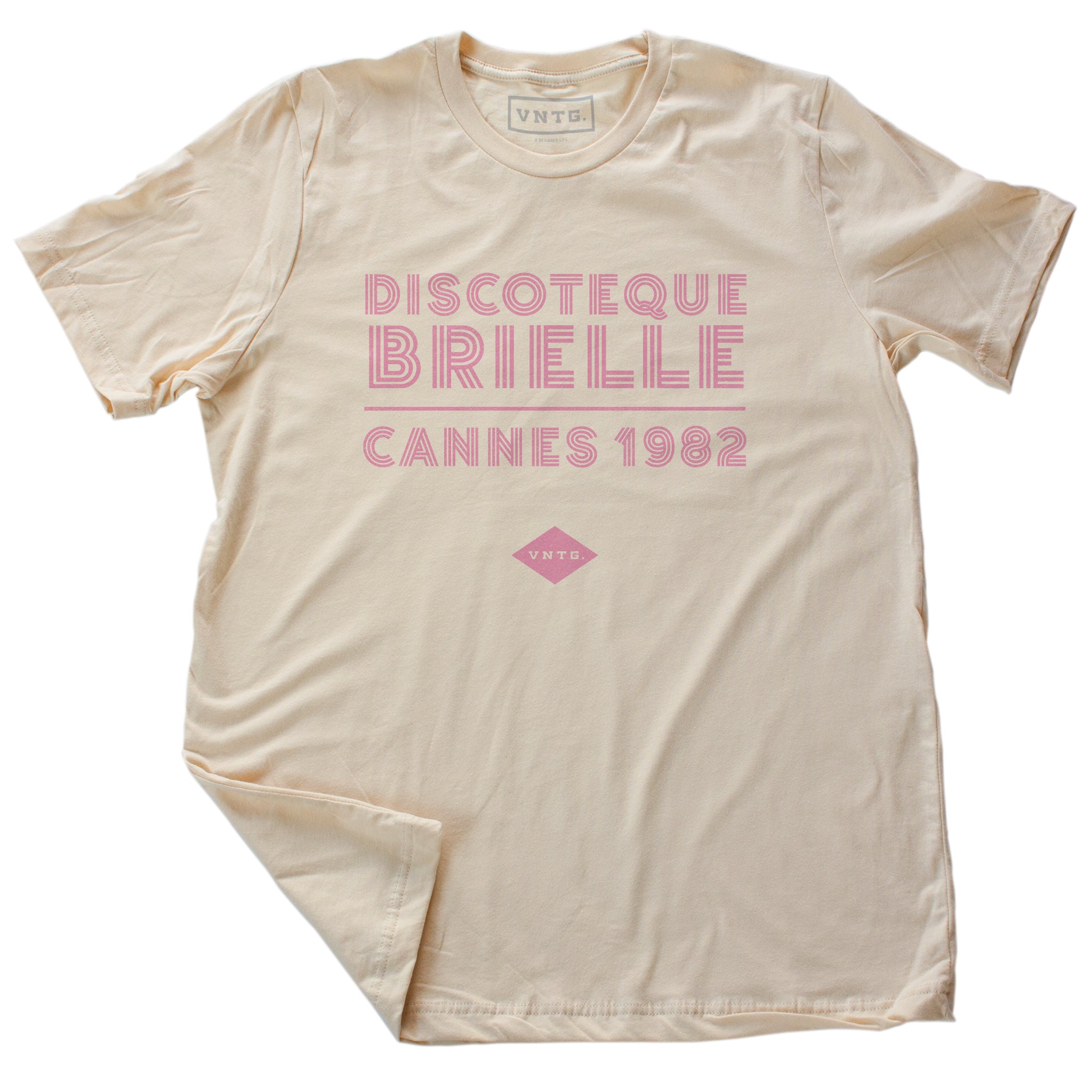 A fashionable classic Soft Cream graphic tee, for a fictional Cannes, France disco from 1982. The retro typography reads “DISCOTEQUE BRIELLE / CANNES 1982” with the VNTG. diamond logo beneath. From Wolfsaint.net