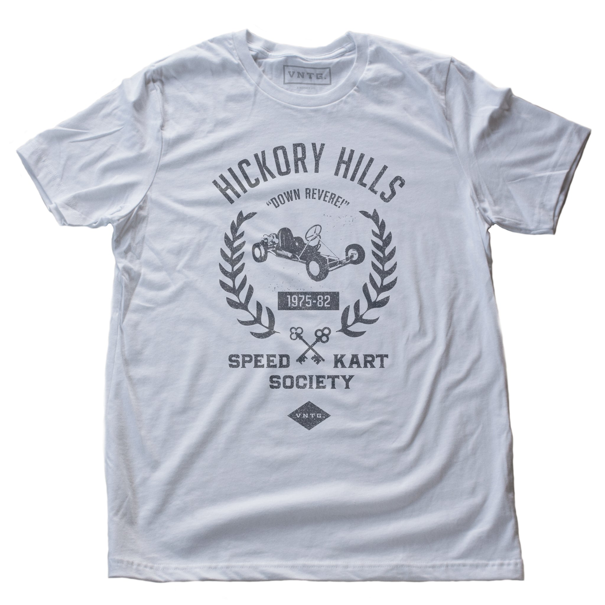 A ‘vintage fiction,’ retro t-shirt in White, picturing a go-kart, promoting a small town racing league from 1975-1982 in Hockessin, Delaware. Inspired by the films of Wes Anderson. By fashion brand VNTG., from wolfsaint.net