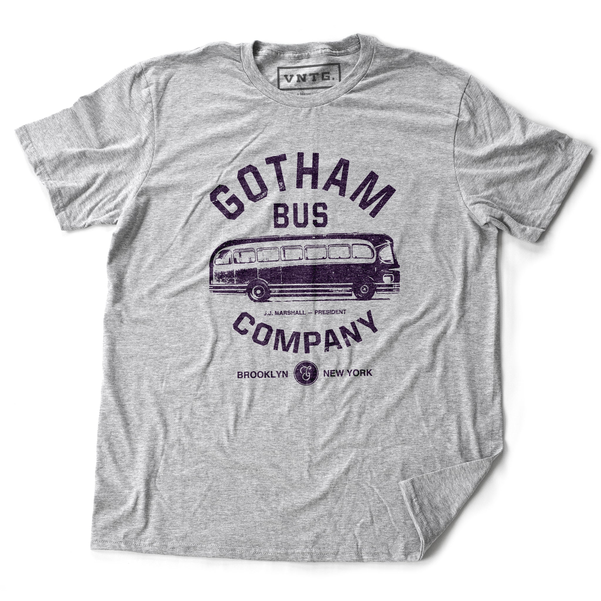 A retro t-shirt in Athletic Heather Gray, inspired by The Honeymooners, a 1950s Classic tv show featuring Jackie Gleason as Ralph Kramden. This shirt is a fictional promotion of the show’s Gotham Bus Company and shows a graphic of an old bus. By fashion brand VNTG, available from wolfsaint.net