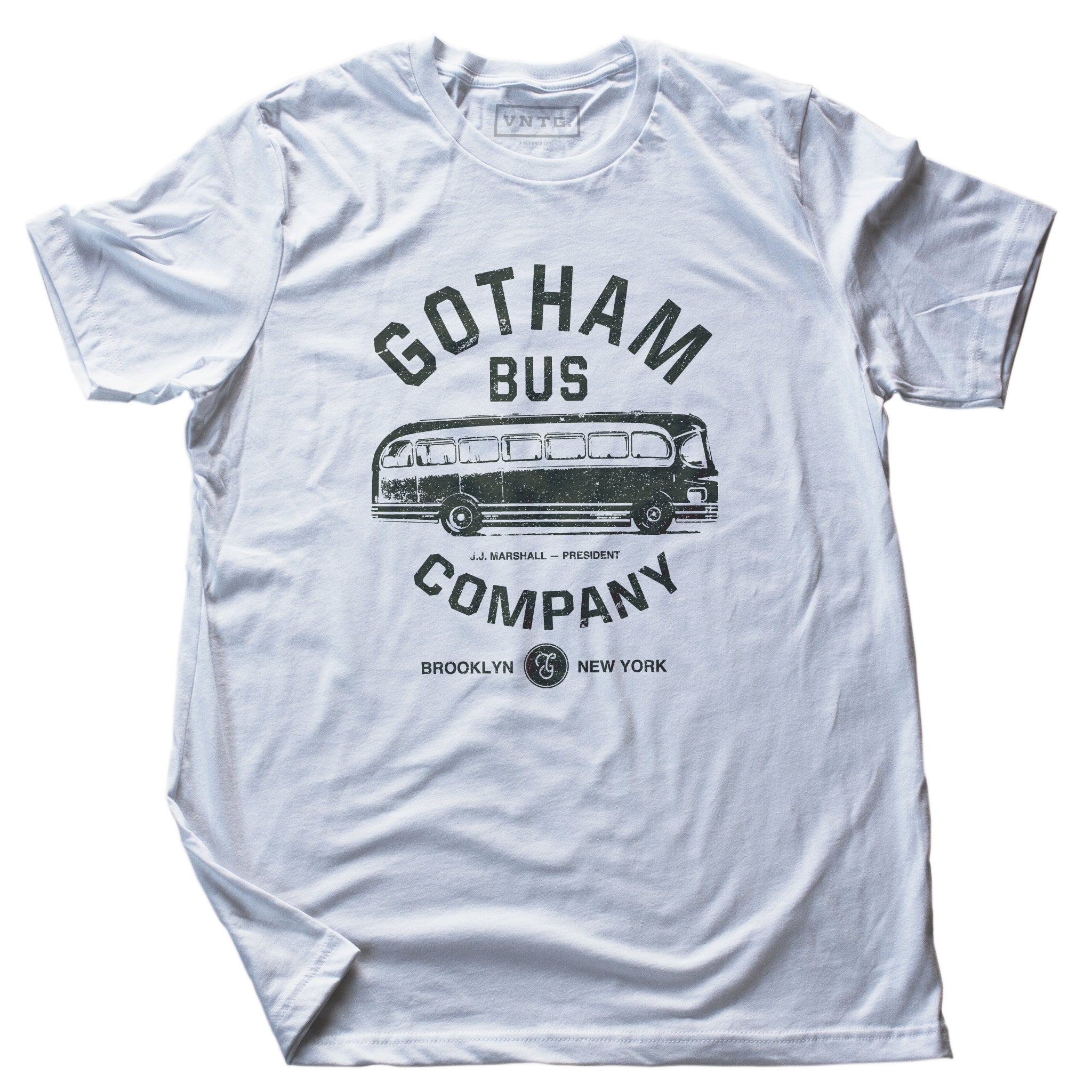 A retro t-shirt in white, inspired by The Honeymooners, a 1950s Classic tv show featuring Jackie Gleason as Ralph Kramden. This shirt is a fictional promotion of the show’s Gotham Bus Company and shows a graphic of an old bus. By fashion brand VNTG, available from wolfsaint.net