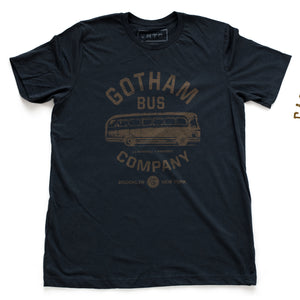 A retro t-shirt in Navy Blue, inspired by The Honeymooners, a 1950s Classic tv show featuring Jackie Gleason as Ralph Kramden. This shirt is a fictional promotion of the show’s Gotham Bus Company and shows a graphic of an old bus. By fashion brand VNTG, available from wolfsaint.net