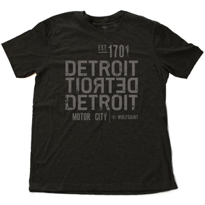 A strong graphic retro dark gray heather t-shirt with the word DETROIT — motor city — in bold typography, forward and backward, from Wolfsaint.net