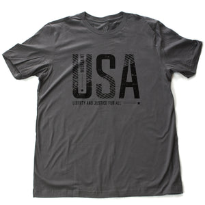 A bold graphic t-shirt featuring large custom-designed font reading “USA” and “liberty and justice for all” below. From wolfsaint.net