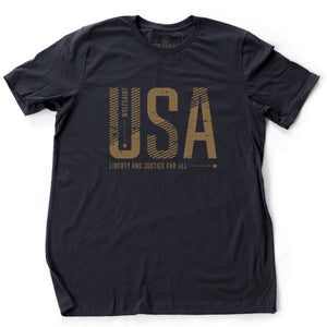 A bold graphic t-shirt featuring large custom-designed font reading “USA” and “liberty and justice for all” below. From wolfsaint.net