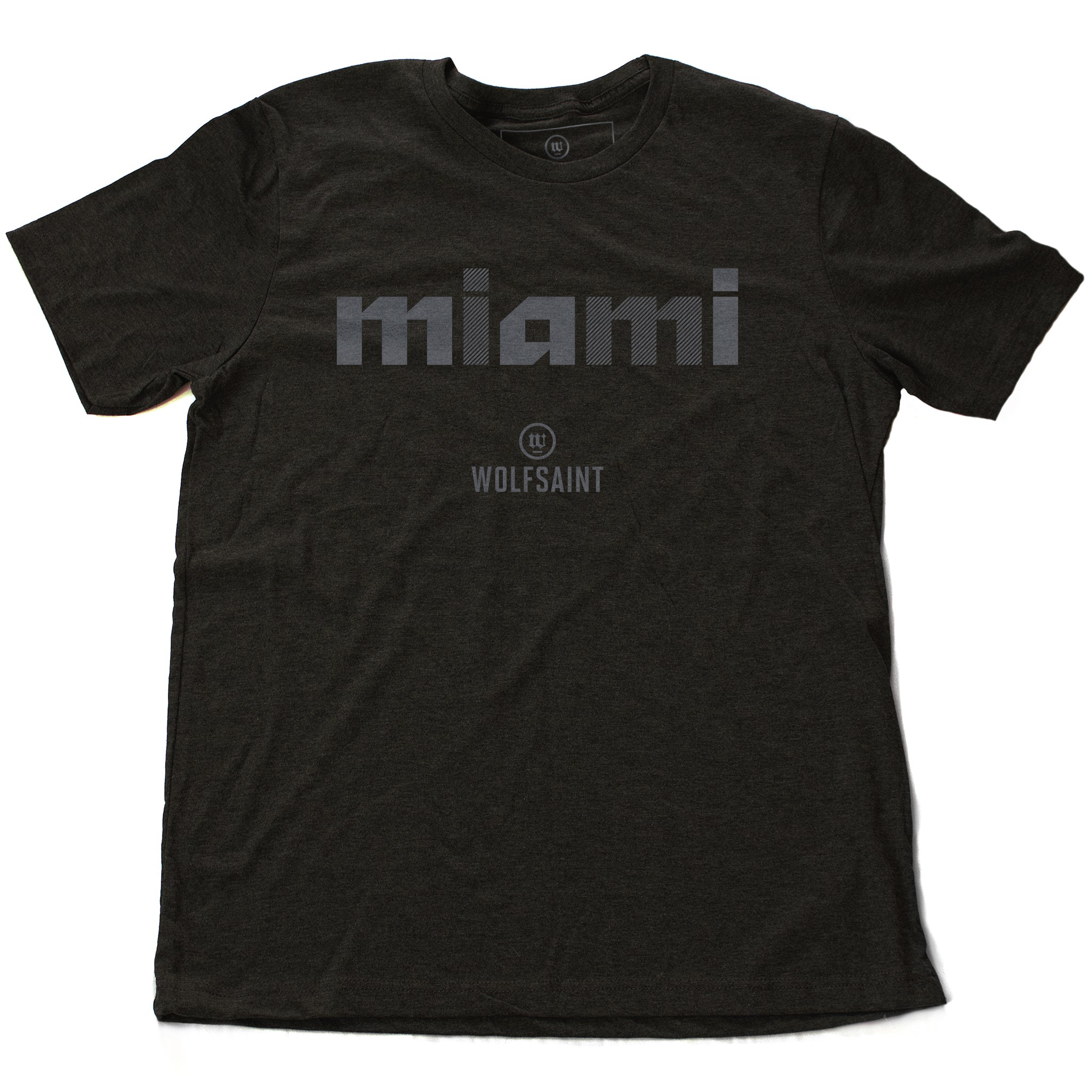 A stylish fashion-shirt in Dark Gray Heather, with a graphic modern typographic treatment of “miami” in Gray crosshatched lowercase letters, with the Wolfsaint logo beneath it. From wolfsaint.net