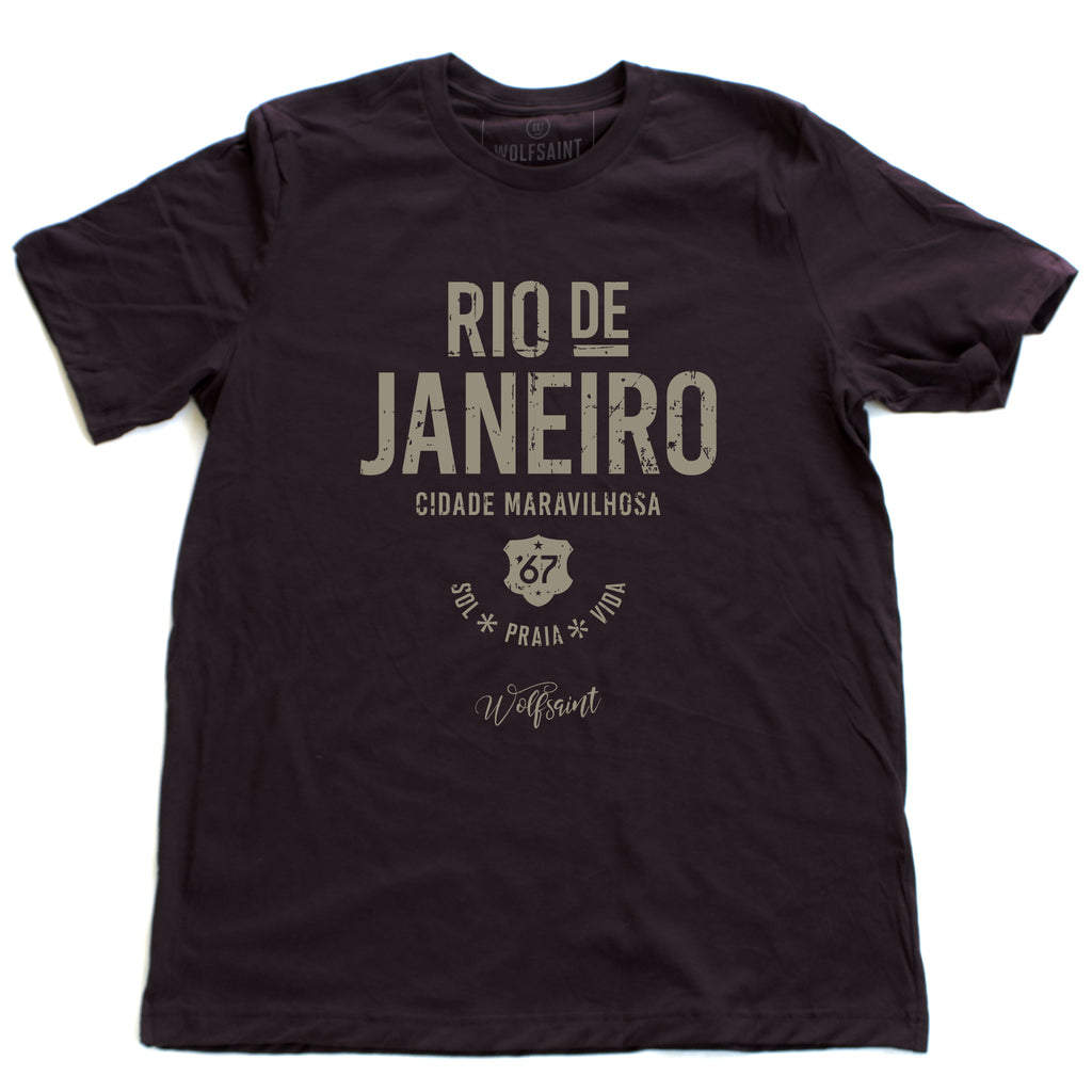 A retro, vintage-inspired t-shirt in Oxblood—deep burgundy—celebrating The Marvelous City, Rio de Janeiro, with the words “sol, praia, vida” below (sun,  beach, life), and the Wolfsaint script logo below that. For wolfsaint.net