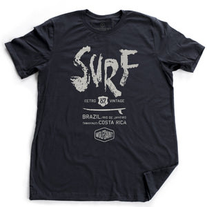 A fashionable graphic t-shirt with a retro, vintage design. This shirt features a surfboard graphic beneath large painted type which reads “SURF” and below it “Brazil, Rio de Janeiro, and Tamarindo, Costa Rica” above the Wolfsaint logo.  For wolfsaint.net