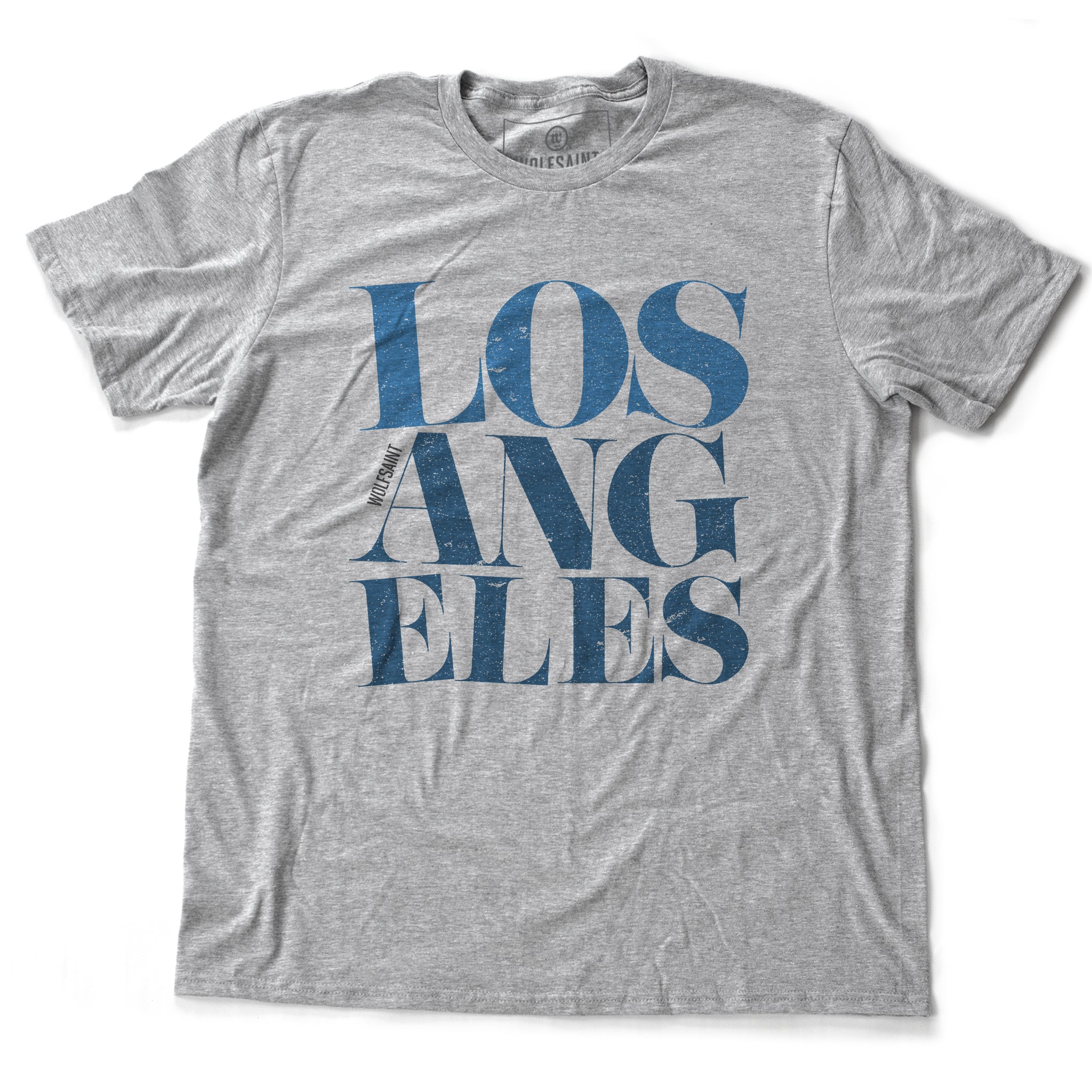 A fashionable heather gray graphic t-shirt featuring the word “LOS ANGELES” in a elegant font, stacked in three tilted lines to sarcastically simulate an earthquake. From wolfsaint.net