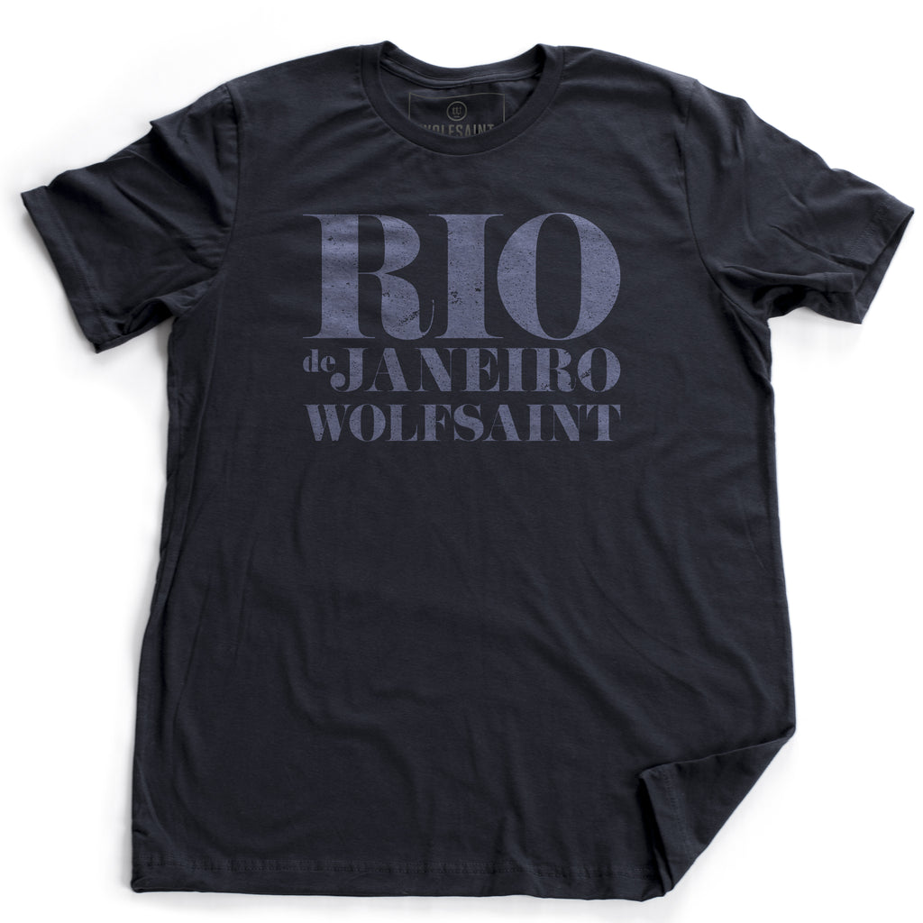 A retro graphic t-shirt in classic Navy Blue, with “RIO” large, above “de Janeiro” and “Wolfsaint” in a bold, fashion-forward font. From Wolfsaint.net