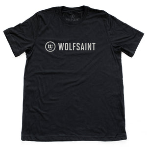 A simple, elegant unisex t-shirt in classic Black with the fashionable WOLFSAINT logo branding across the chest in parchment white. From Wolfsaint.net