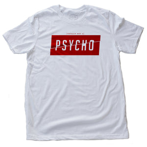 A sarcastic fashion t-shirt featuring a vivid red graphic with the word “PSYCHO” split in half diagonally, within a rectangle, to represent a ‘fractured’ personality. Above the box are the words “totally not a...” in a much smaller font. From fashion brand YUF, available on wolfsaint.net