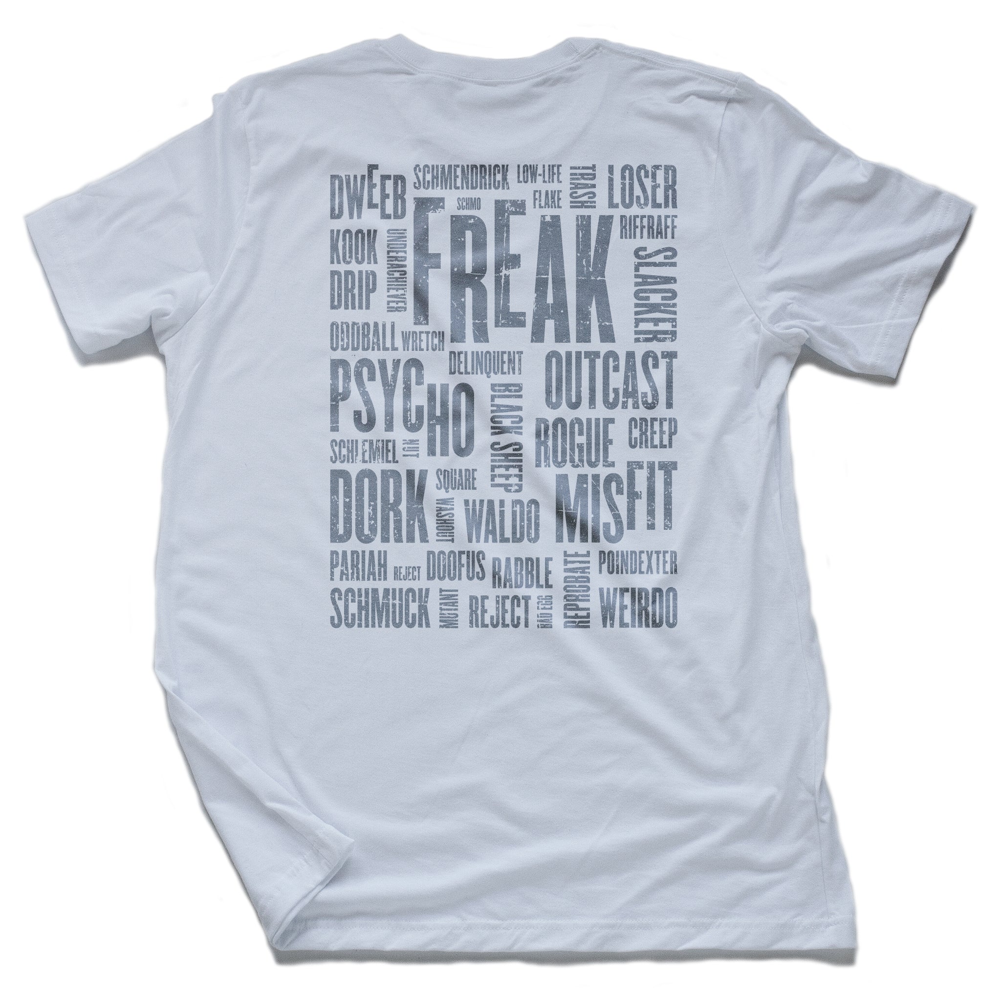 A sarcastic graphic t-shirt in white, featuring a collage of self-deprecating “nerd,” “freak,” and “geek” synonyms. By fashion brand YUF, from wolfsaint.net
