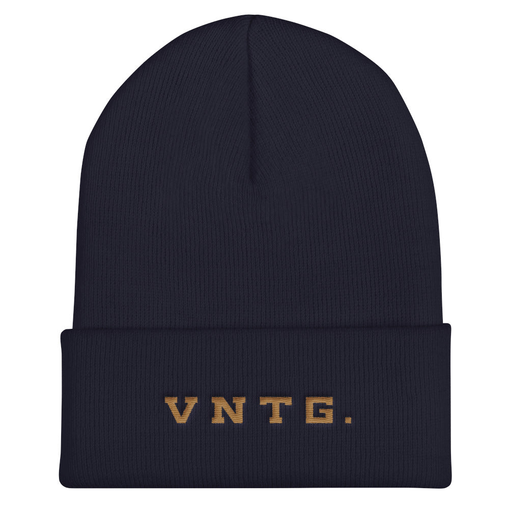 A stylish knit cap or beanie in classic Navy Blue, with the brand logo VNTG. embroidered in gold thread. From wolfsaint.net